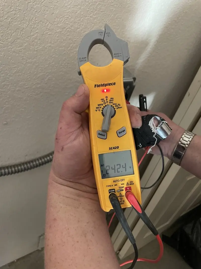 Voltage testing with clamp meter during Electrical Installation Services in North Fork